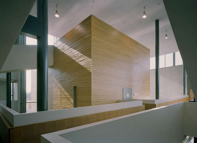 Wooden rectangular structure inside the building.