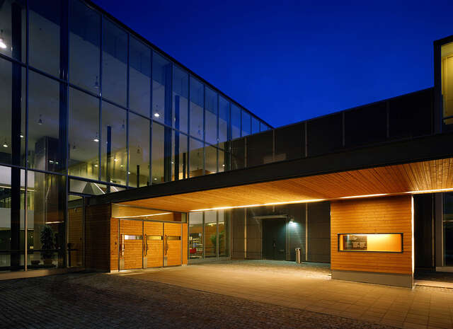 Illuminated entrance during the evening.