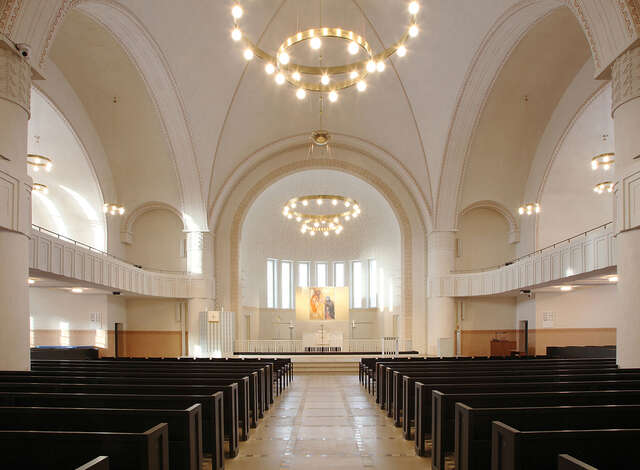 View towards the altar in a simple but ornate church.