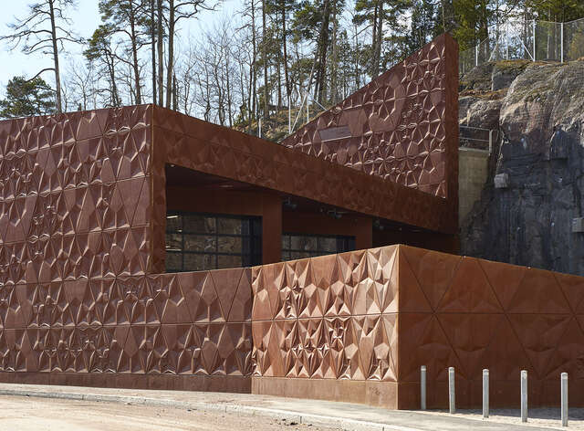 Triangular concrete elements of the façade resemble the shape of an origami.
