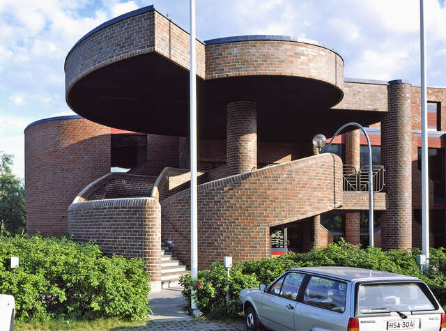 Spiral staircase made of red brick.