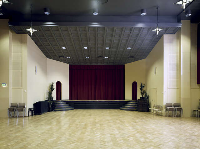 auditorium with black, white, red and wooden elements