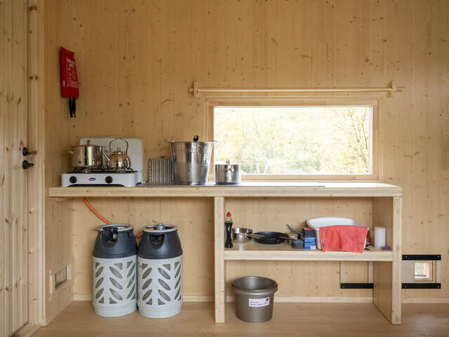 A small room with a cooking station