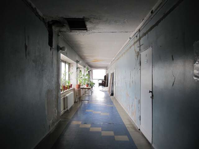 Abandoned hallway in bad condition.