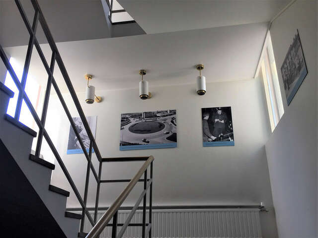 Stairway with pictures hanging on the wall.