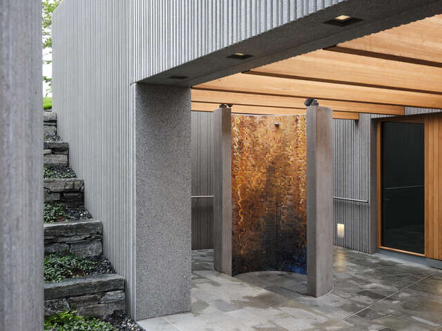 Concrete walls with wood ceiling and details.