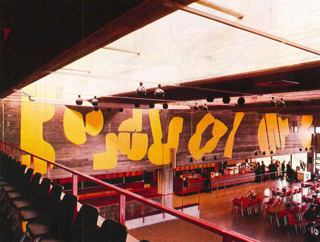 Interior of the mess, yellow painting on the wall.