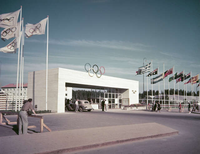 Flags and a gate with the logo of Olympic Games
