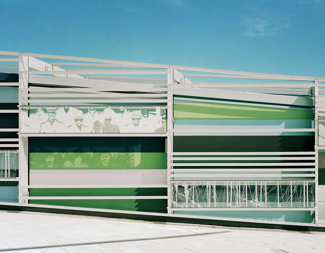 DIfferent colored and patterned glass on the building exterior.