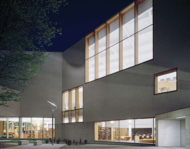 Largw windows on the library facade during the evening.