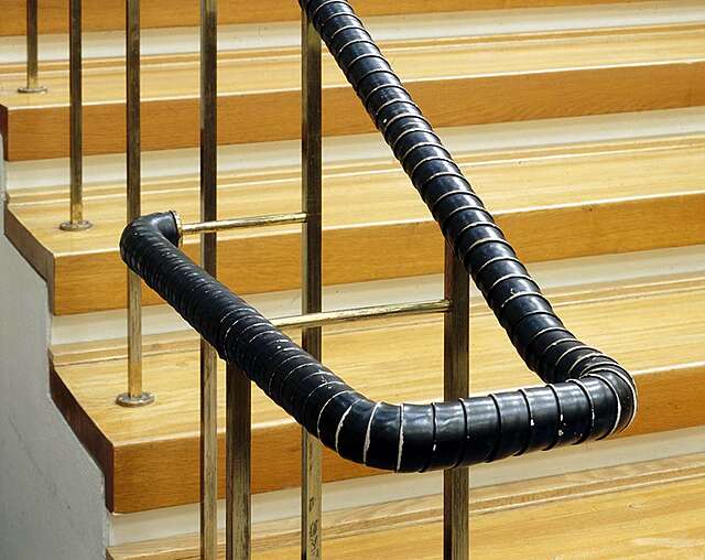 Railing covered by wrapped leather.