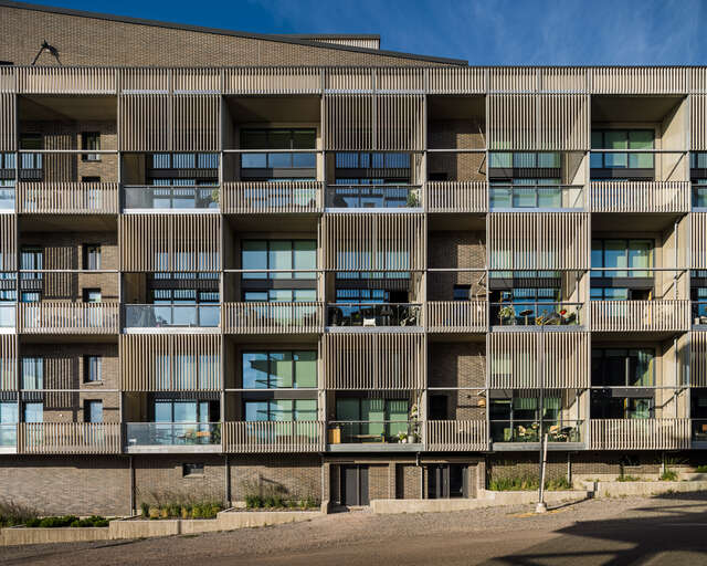 Square-shaped balconies on the side of an apartment building.