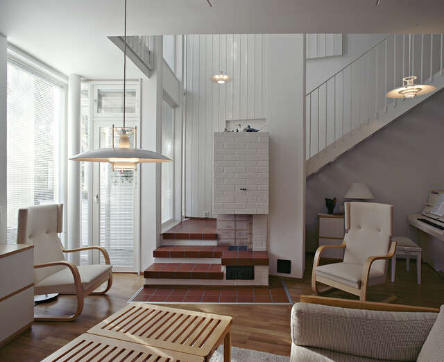 Living room with mostly white and light wooden elements