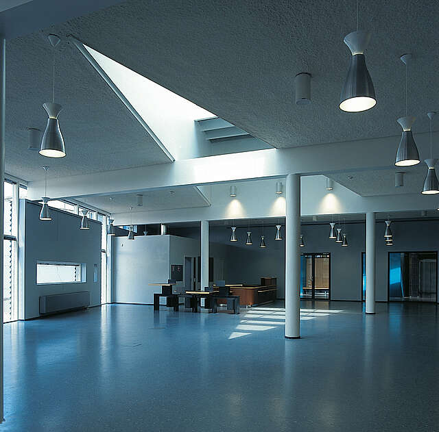 White interior with blue vinyl flooring.