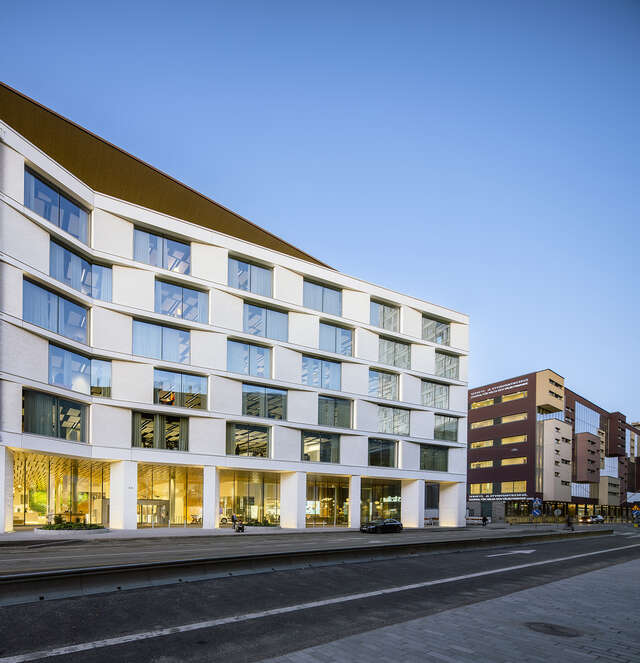 Main facade from the street side in evening light