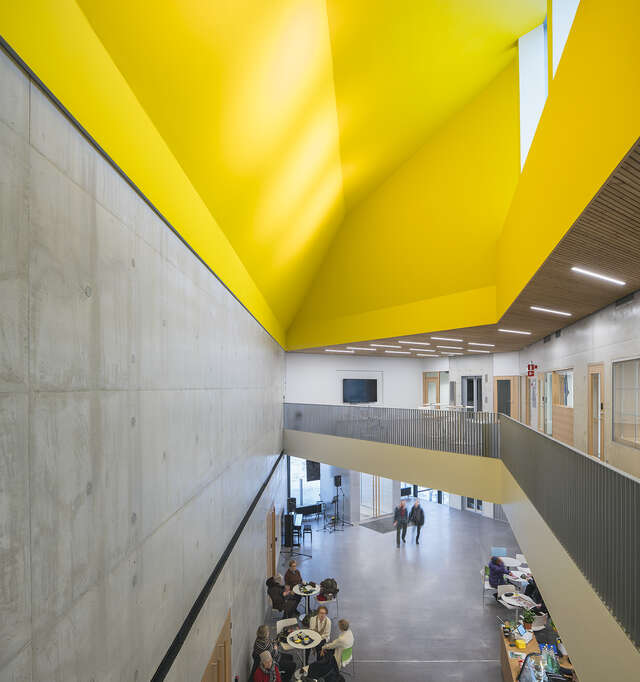 Yellow ceiling in an otherwise neutral building.