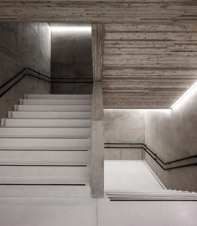 Close-up photo of a stairwell, war-coloured concrete
