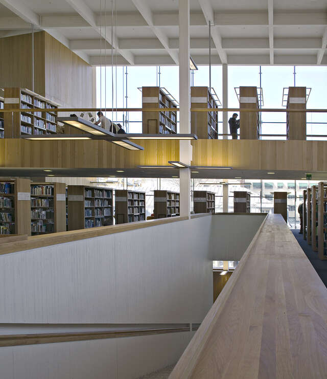 Library interior with wooden and white elements.