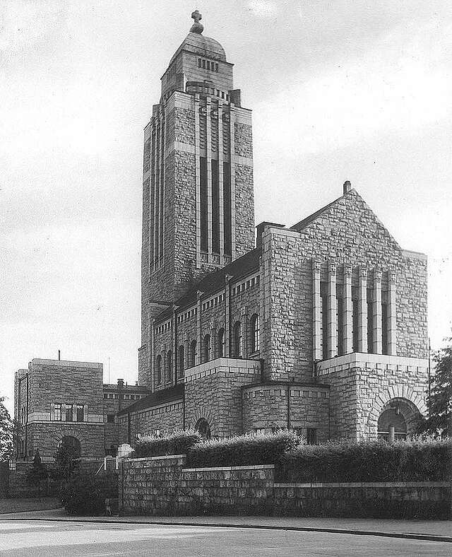 Entrance side façade with nave and tower