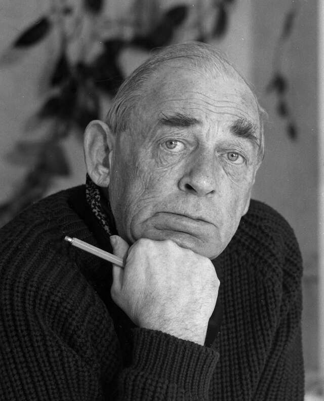 Alvar Aalto, a old man with a serious expression and a pen in his hand.
