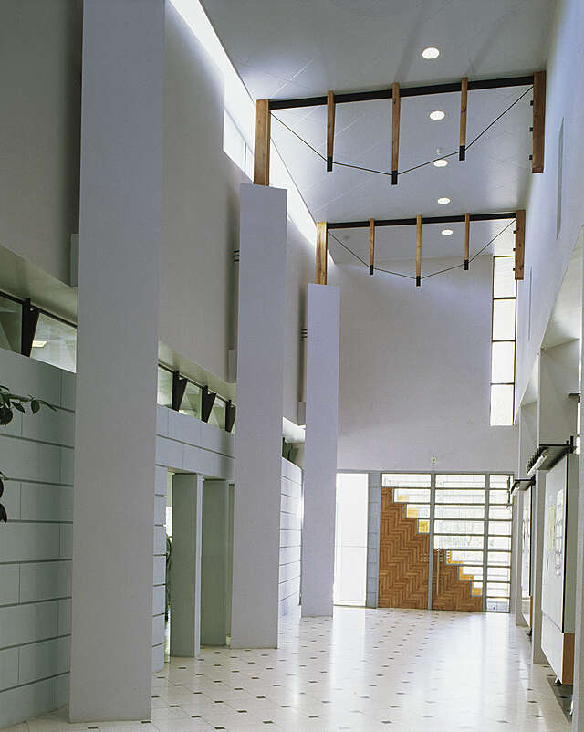 hallway with tile, glass and wood details.