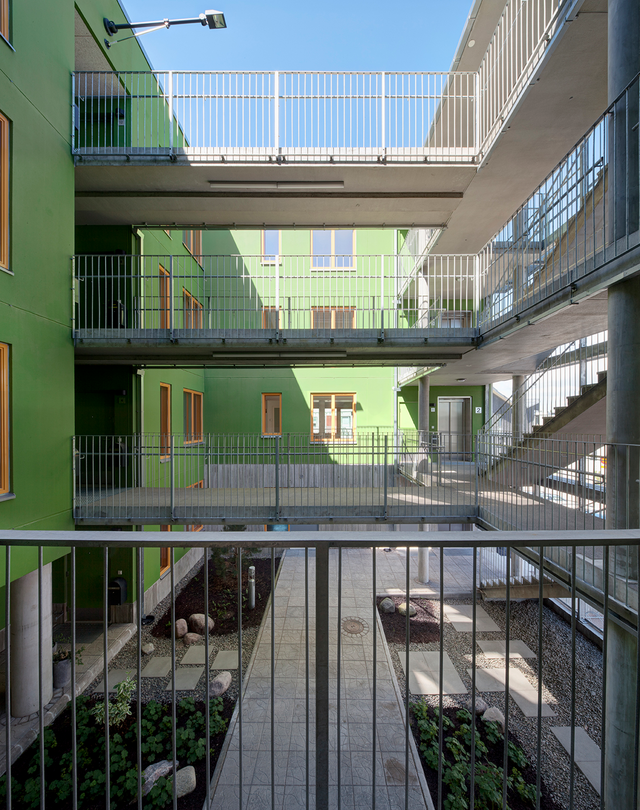 Courtyard of apartment building with green walls