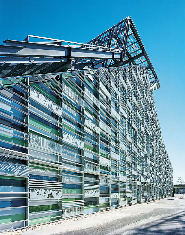 Building exterior with different colored glass panels.