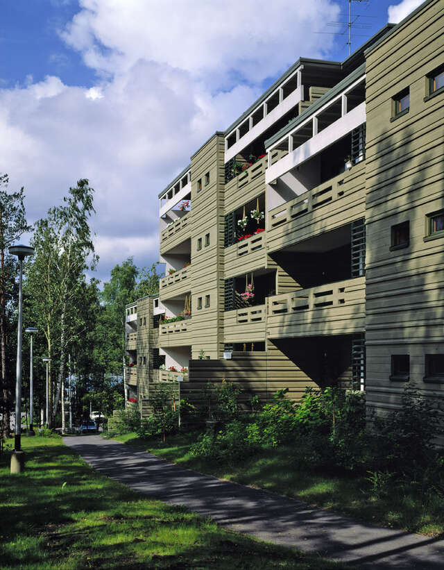 Green facade with few white elements.
