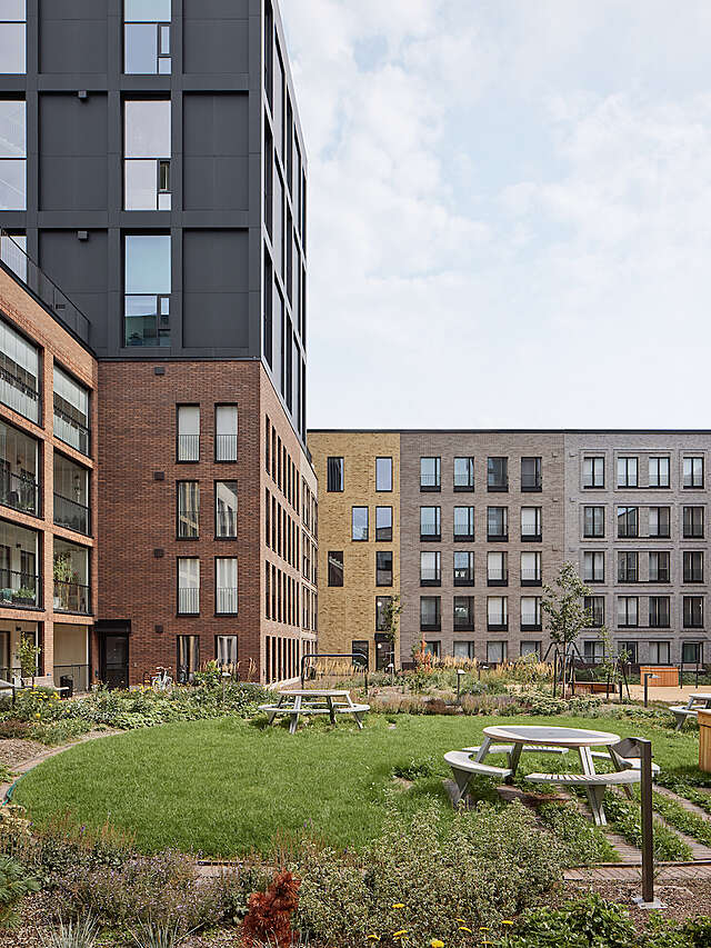 Large apartment building and grass