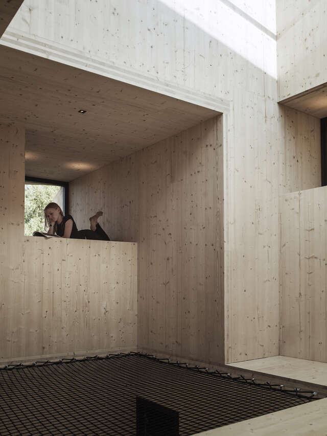 Interior of wooden structure. Child laying within structures.