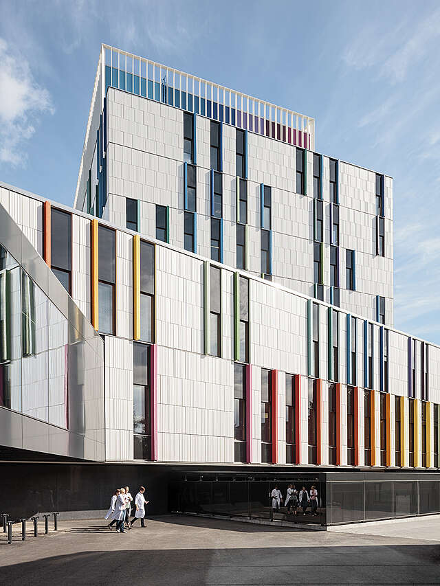 Colorful bars on an otherwise white facade.