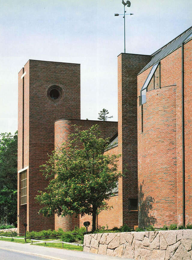 Modernist red-brick church and its bell tower.