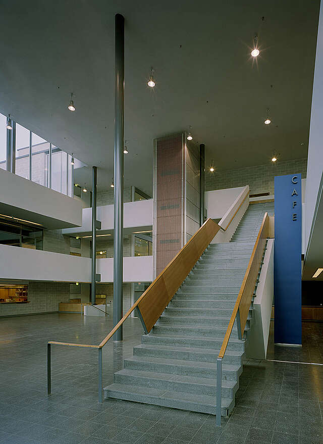 Concrete stairs with wood railings.