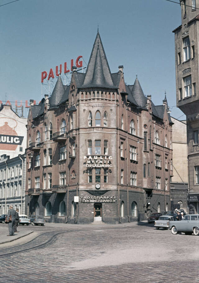 Four storey building at the corner of the street.