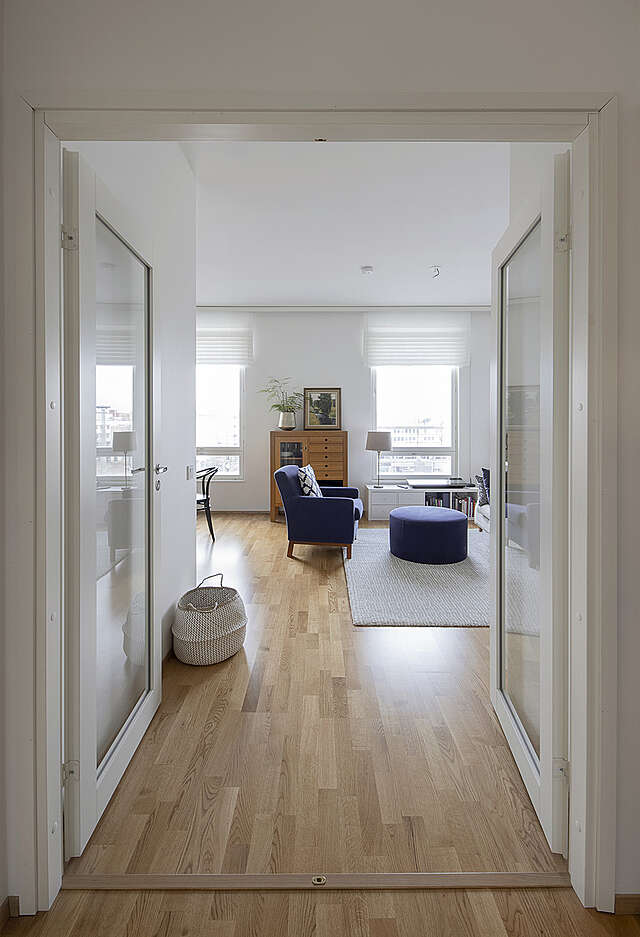 View from a glazed double door towards a living room