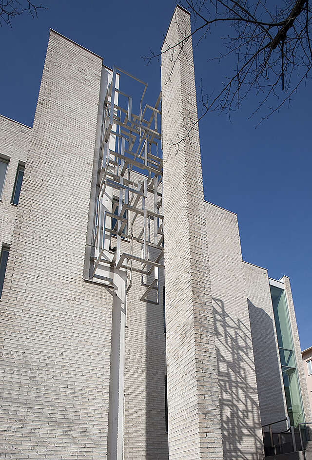 Metal geometric sculpture on the building.