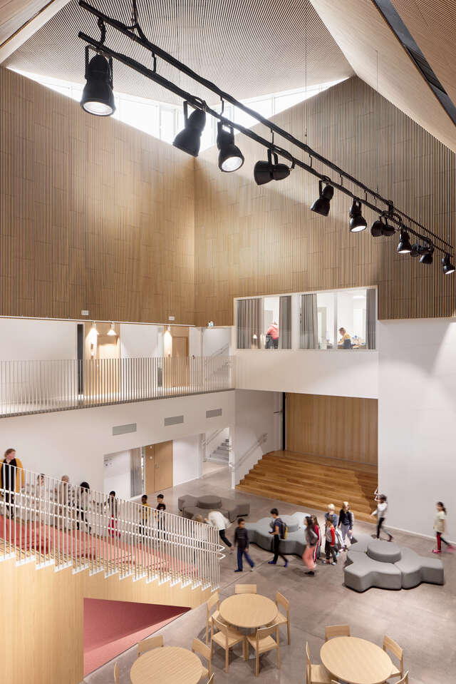 A large, open room within a building, with seating reminiscent of a lecture hall.