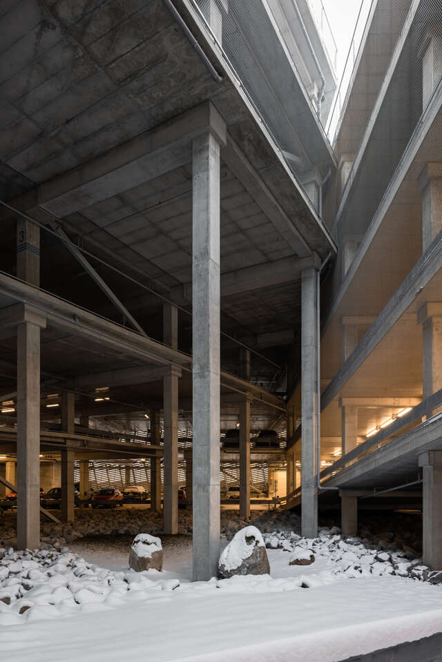 concrete pillars holding up a parking garage
