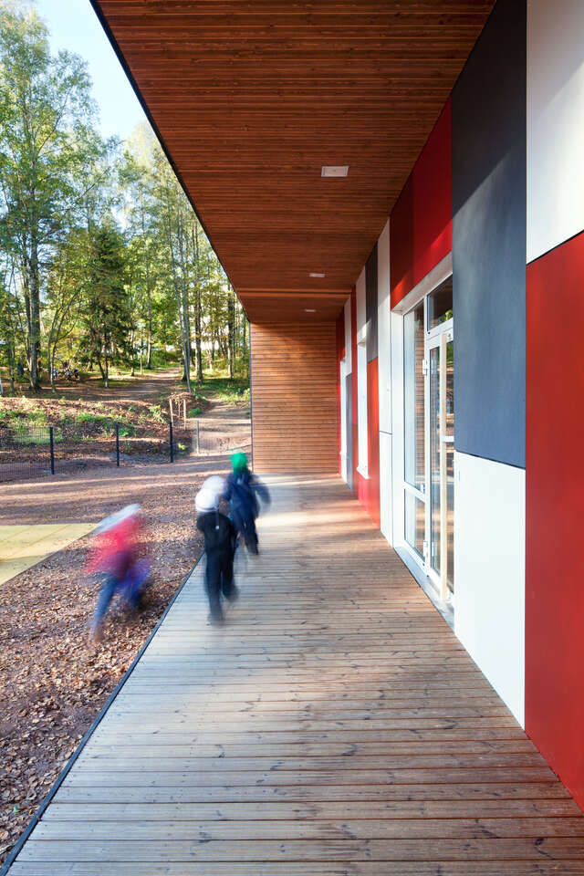 The front of the building has wooden roof covering the entrance