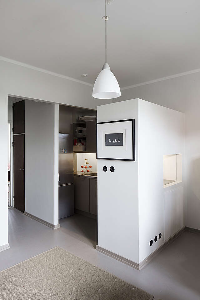 Small kitchen corner in a white room.