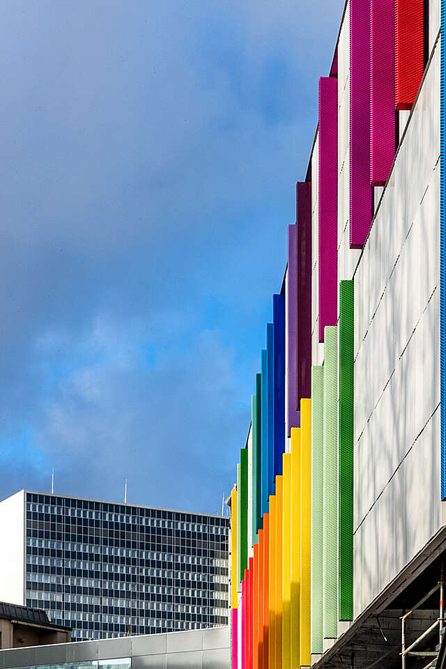 Rainbow colored details on the otherwise neutral hospital facade.