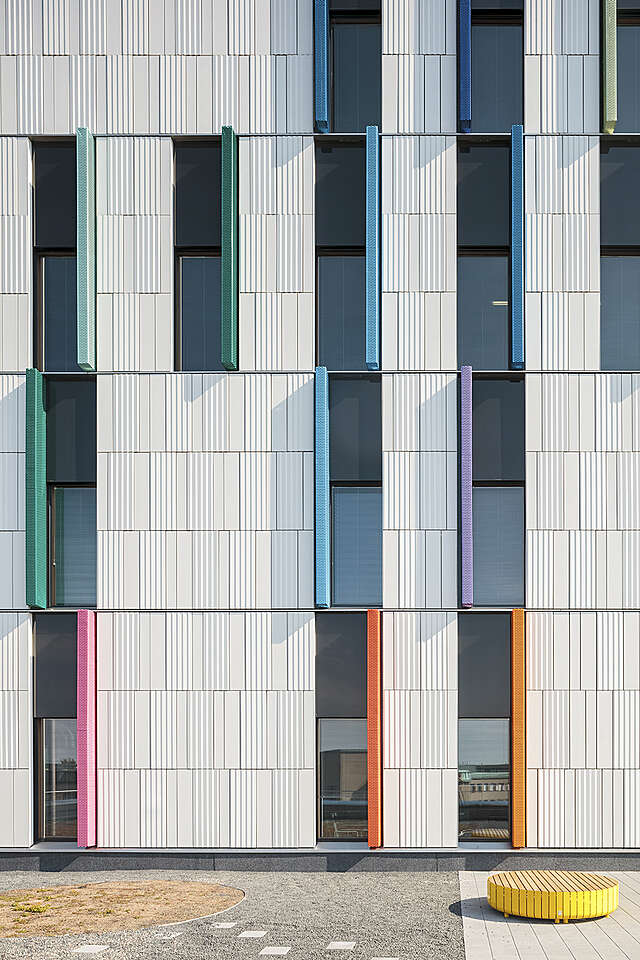 Colorful bars on an otherwise white facade.