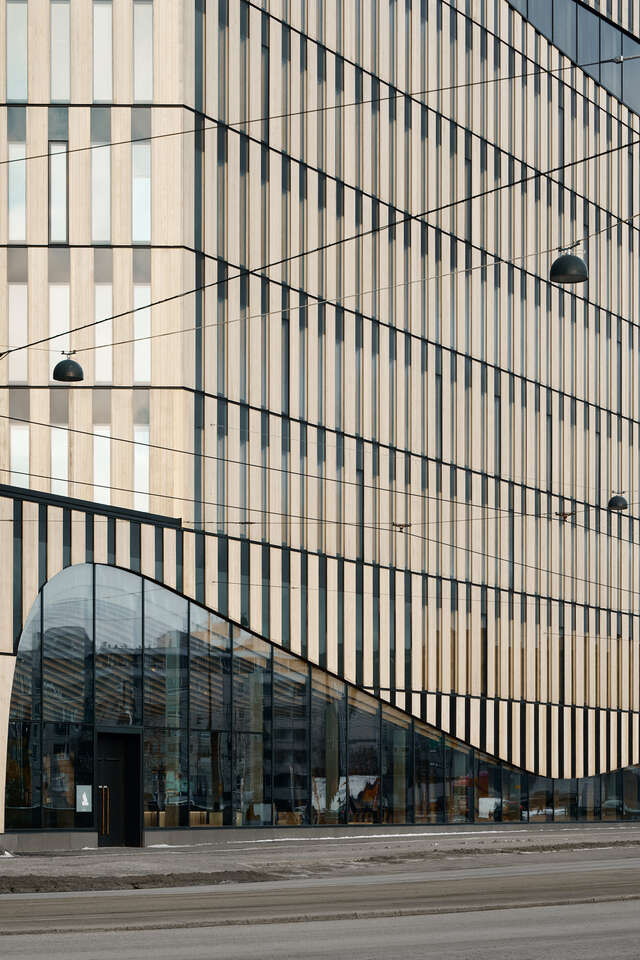 Exterior of the building with a street in the foreground.