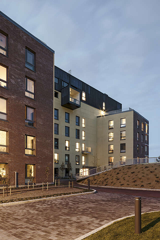 Inner courtyard with plain areas and plaster stone pathways.