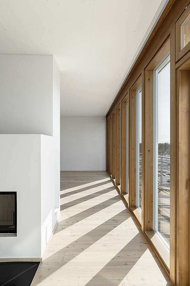 Long window wall on the entire side of eh apartment.