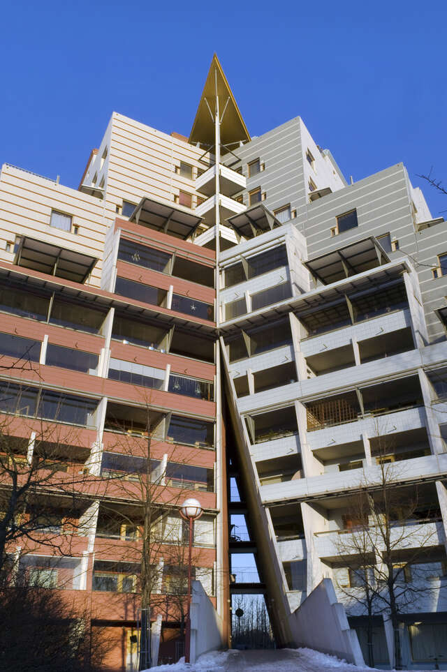Detail of the red and blue colored v-shaped layout of the building