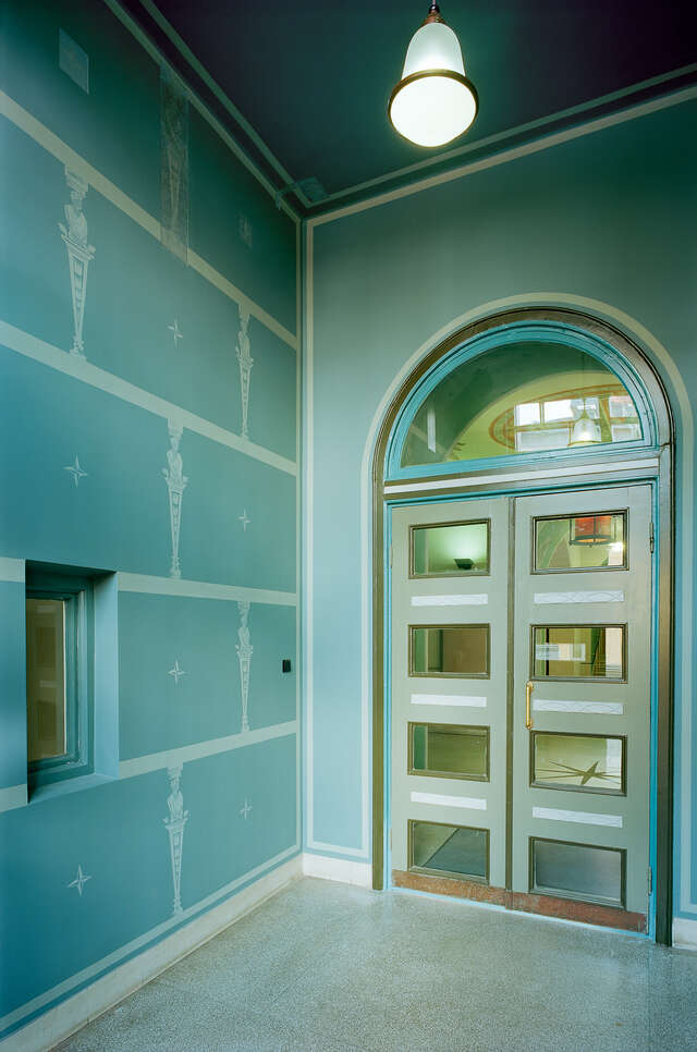 Light green and door with windows and arch